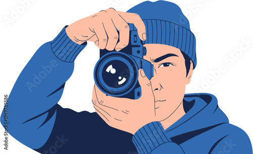 A focused young photographer in a blue beanie and hoodie skillfully capturing a moment with his camera, embodying the passion for visual storytelling and creative expression