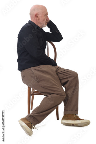 Bild auf Leinwand Side view of a man sitting asleep in a chair
