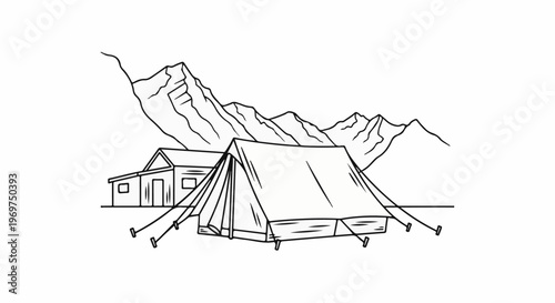 Tent and cabin in front of a mountain range