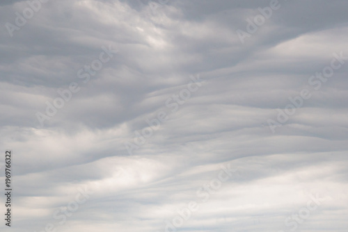 Moody sky with stratocumulus cloud textures, subtle gradients and natural tones, perfect for atmospheric, weather, and background imagery.