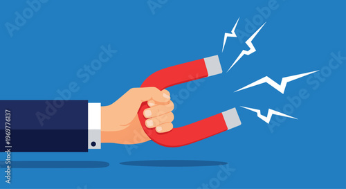 Business hand holding a red magnet representing customer attraction, lead generation, and powerful marketing strategy.