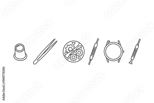 Watchmaking tools and components laid out for repair or assembly