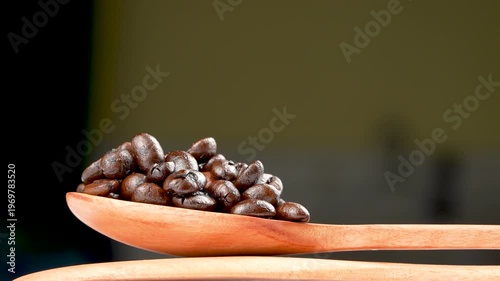 Cinematic eye-level rotating macro of glossy dark roasted coffee beans on a wooden spoon. Premium moody texture with shallow depth of field.