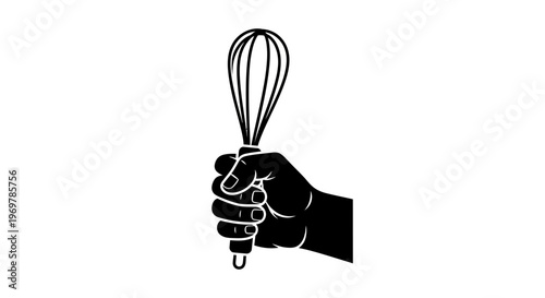 Hand holding a whisk tightly.
