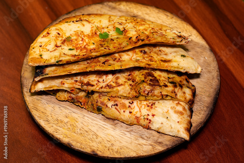 Golden Stuffed Masala Kulcha on Rustic Wooden Plate
