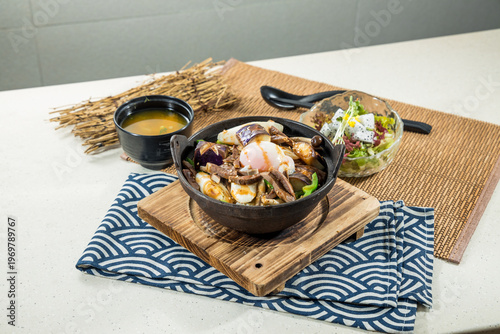 Hearty pot rice with onsen egg and vegetables