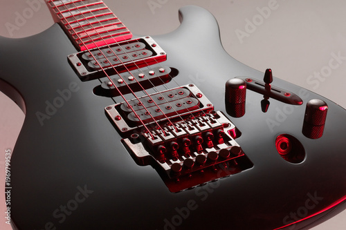 black gloss electric guitar with colored mirror, rock style