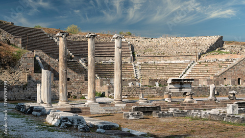Asclepieion Roman theater ruins, Pergamon, Bergama, Turkey. Ancient columns and stone seating under a blue sky with cirrus clouds