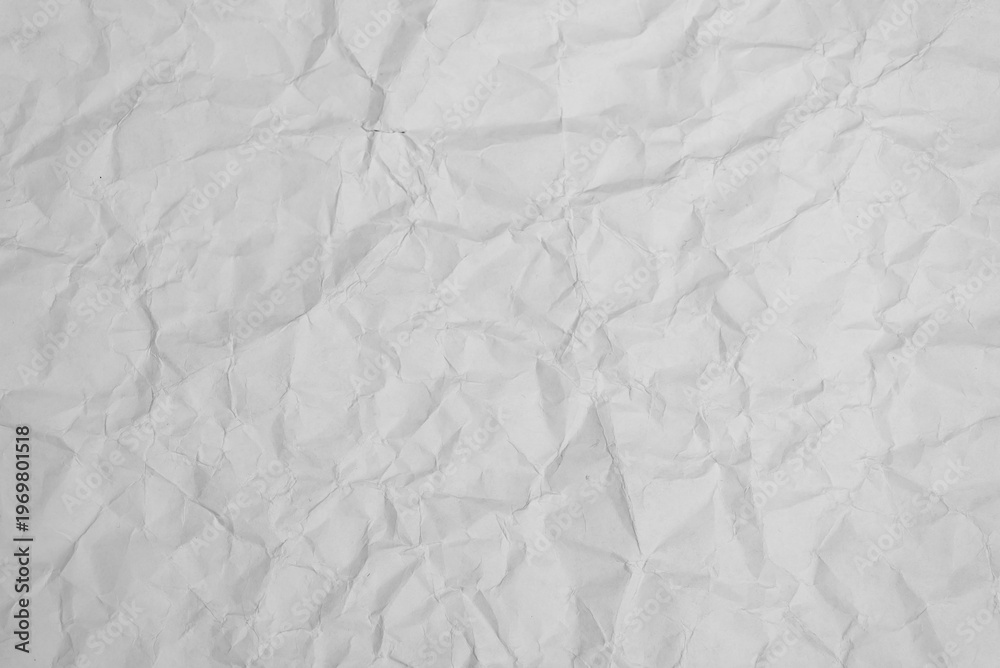 Naklejka premium crumpled sheet of white paper, abstract background, texture