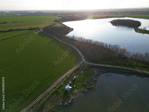 Canvas Print A tranquil rural landscape from a bird's eye view at sunset Two lakes with a qui