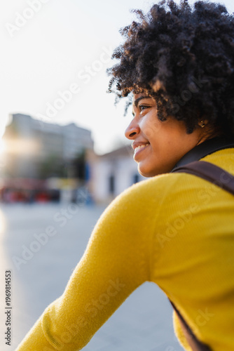 Happy black woman enjoying city life feeling freedom