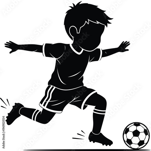 Silhouette of a young boy enthusiastically kicking a soccer ball during a game