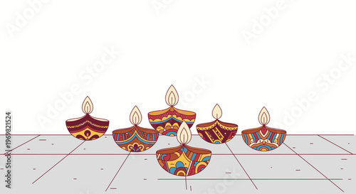 Collection of colorful traditional Indian diyas illuminated with flames on a patterned surface, celebrating Diwali