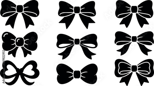 Black silhouette bows set with ribbon tails and heart shapes