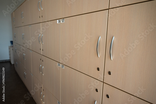 Side view of storage cabinets. Safe boxes. Archive cabinets with numbers. Symmetrical shot of  storage lockers featuring numbers and key locks.