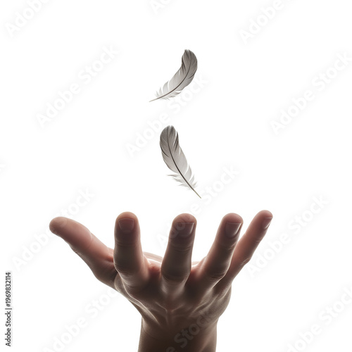 Hand holding feathers capturing the essence of lightness and freedom.