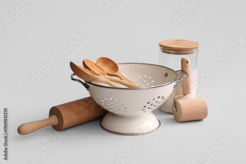 Colander with wooden spoons...