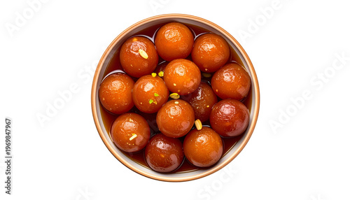 Overhead shot of a bowl filled with glistening brown, syrup-soaked, spherical desserts