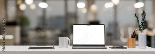 Office desk in co-working office room with laptop blank screen and copy space on white table 3D render