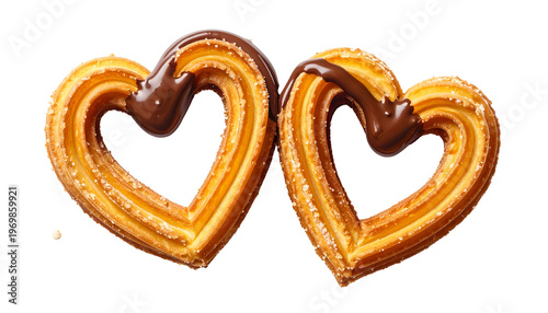 Two heart-shaped fried pastries with chocolate drizzle, on black, detail shot