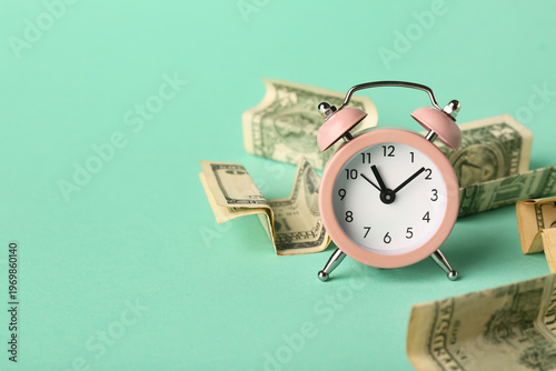 Alarm clock with money on t...