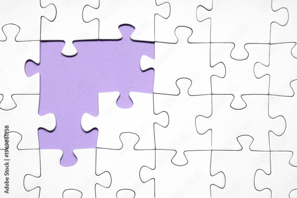 Fototapeta premium White jigsaw puzzle with missing pieces on purple background