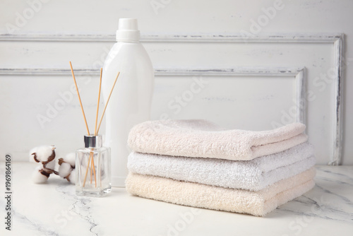 Clean towels, bottle of lau...
