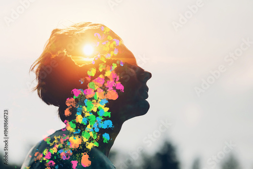 Obraz na plátně Transgender bisexual man queer with rising sun and rainbow colors inside his head