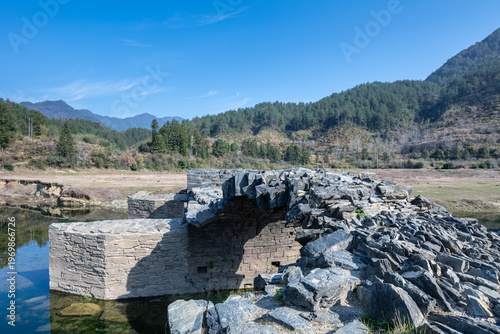 Wallpaper Mural Detail shot of a deteriorated  ancient stone arch bridge Torontodigital.ca