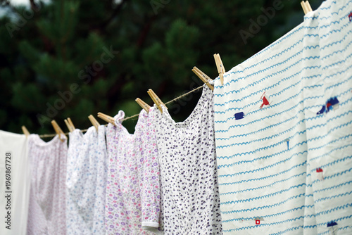 The laundry is dried on ropes secured with clothespins.                              