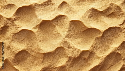 Closeup View of a Golden Sand Dune with Smooth Wave Grain Texture and Tropical Sea Background