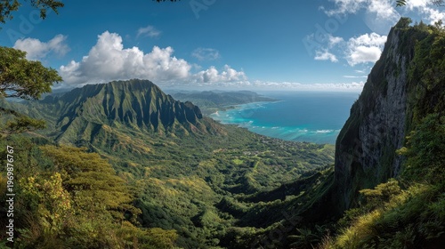 Aerial panorama of tropical rainforest and rugged Koolau cliffs above Oahu's windward coast