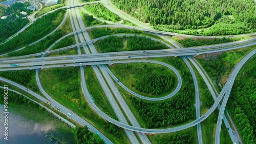 Aerial View of a Complex Highway Interchange Surrounded by Lush Green Vegetation and Forests in Finland