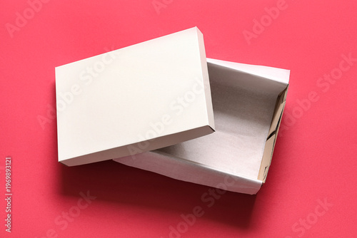 White empty shoebox on red ...