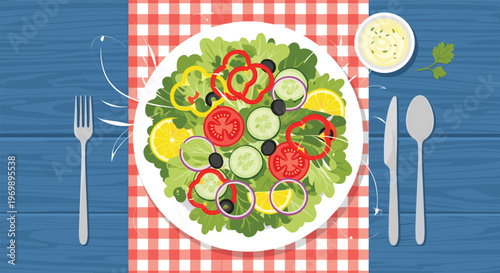 Healthy fresh vegetable salad in a white bowl served with a fork, spoon, and knife on a blue wooden table.