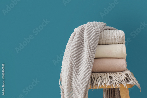 Wooden table with stack of ...