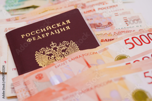 Russian passport and money showing financial literacy and currency exchange from Russia