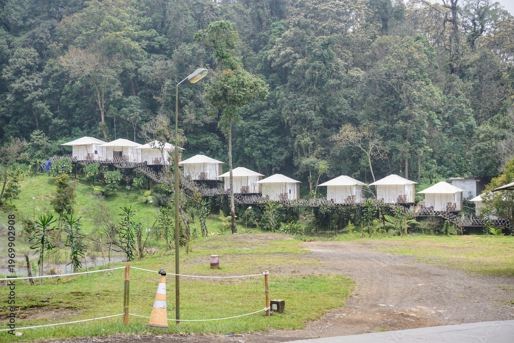 custom made wallpaper toronto digitalModern camping site with comfortable tents surrounded by forest and meadow, ideal for nature tourism.