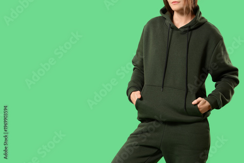 Young woman in sports suit ...