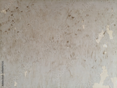 Top View of a Weathered Grey Concrete Surface with Large Damp Stains and Textured Pitting