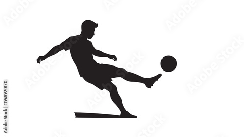 Silhouette of a Professional Soccer Player Kicking a Ball During an Intense Match