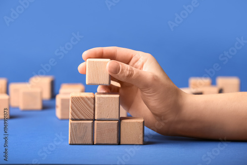 Female hand with wooden bui...