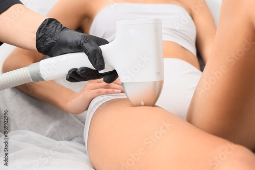 Female cosmetologist perfor...
