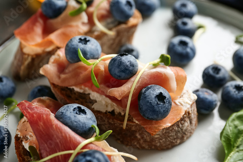 Tasty canapes with jamon, c...