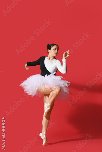 Young ballerina in tutu dan...