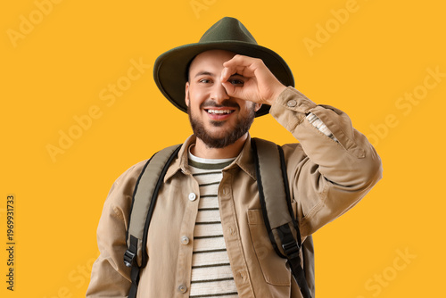 Young male tourist looking ...