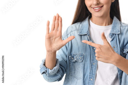 Young woman using sign language on white background, closeup