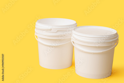 White plastic paint buckets...