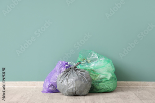 Full garbage bags on floor ...
