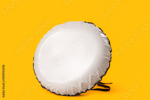 Snow tube on yellow background